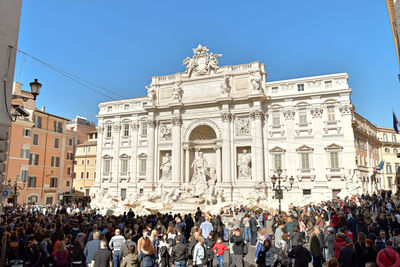 Group of people in front of historical building