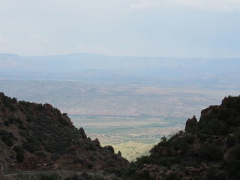 Scenic view of landscape and mountains against sky