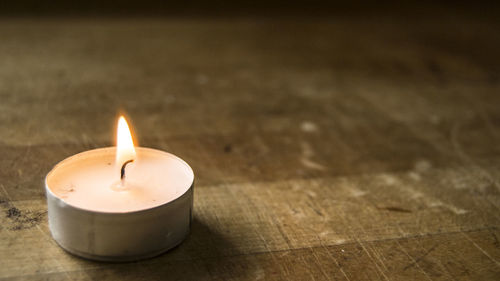 Close-up of illuminated candle