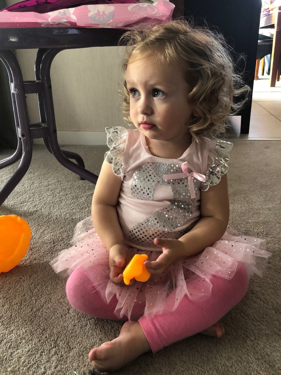 child, childhood, baby, one person, food, real people, young, sitting, cute, toy, indoors, looking, innocence, babyhood, females, full length, looking away, front view