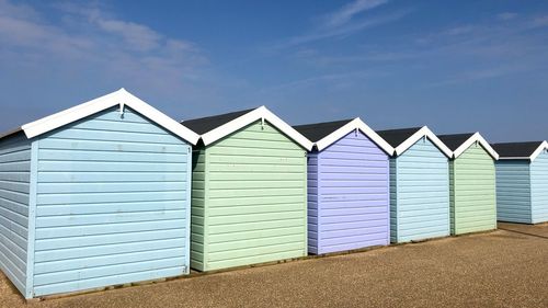 Beach huts against sky