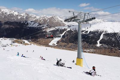 People skiing on snowcapped mountain