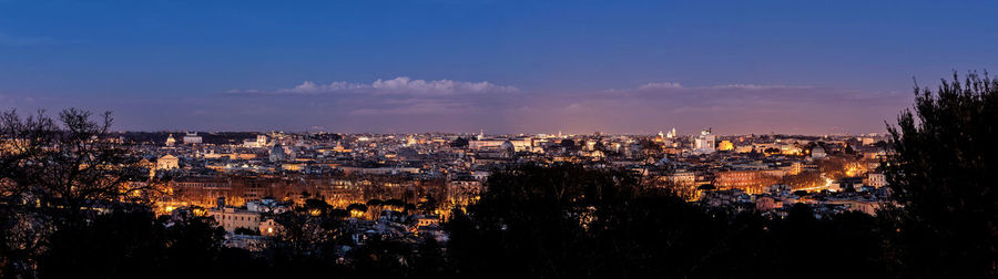 High angle view of illuminated cityscape against sky