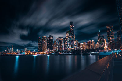 Illuminated buildings in city at night