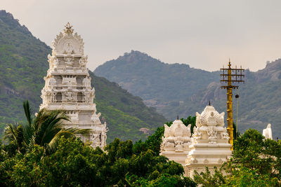 View of temple against building