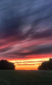 Scenic view of dramatic sky during sunset
