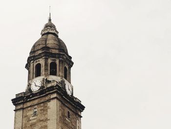 Low angle view of clock tower against sky