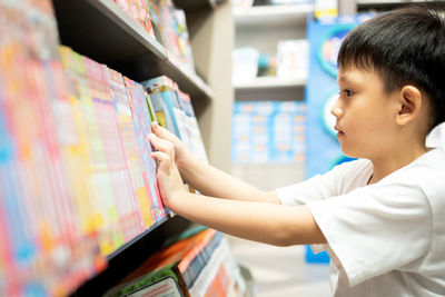 Boy standing in store