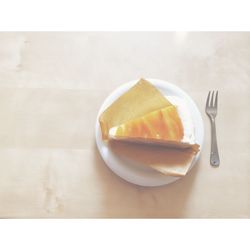 High angle view of cake slice in plate on table