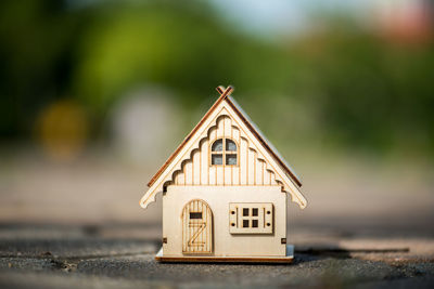 Close-up of model home on footpath