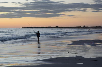 Fisherman at sunset. back beach. geraldton. coral coast. western australia