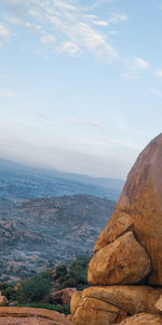 Rock formations on landscape against sky