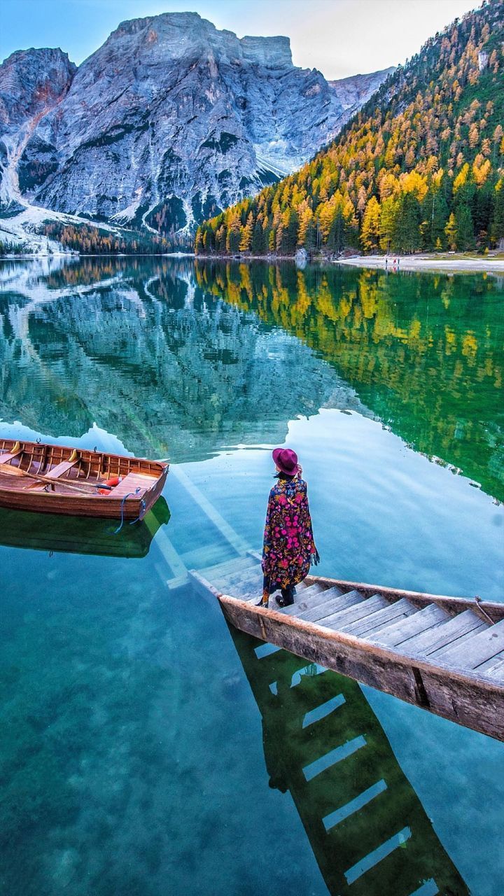 water, lake, reflection, mountain, day, transportation, beauty in nature, nature, real people, one person, tranquility, mode of transportation, tranquil scene, nautical vessel, scenics - nature, women, rear view, outdoors