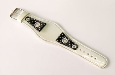 High angle view of piano on table against white background