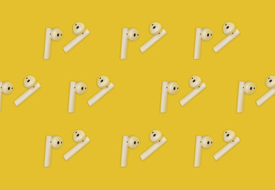 Close-up of toy blocks on yellow background