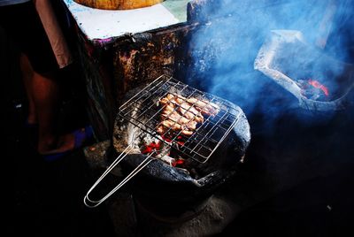 Low section of man preparing food