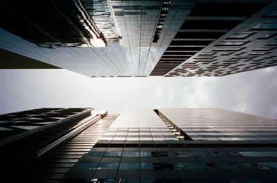 Low angle view of modern buildings against sky