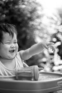 Happy child gesturing on high chair