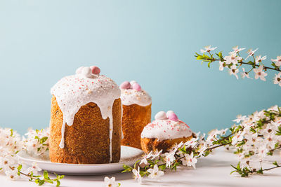 Easter cake with glace icing and decoration. postcard with easter bread. christian traditions.
