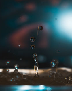 Close-up of drop falling in water