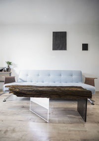 Empty chairs and table against wall at home