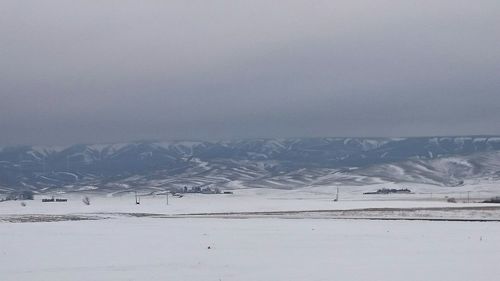 Scenic view of frozen lake against sky