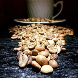 Close-up of roasted coffee beans on table