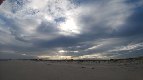 Scenic view of beach against sky during sunset