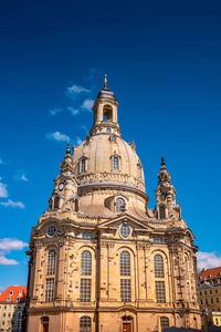 Low angle view of building against blue sky