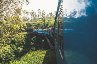 Panoramic view of train on land against sky