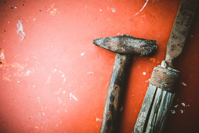 High angle view of rusty hammer on table