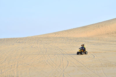 Man cycling on landscape