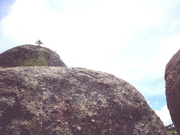 Low angle view of rock against sky