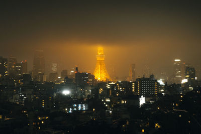 Aerial view of city lit up at night