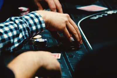 Close-up of man playing piano