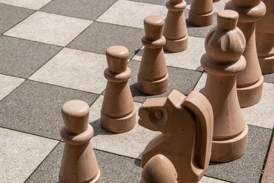 High angle view of chess pieces on floor