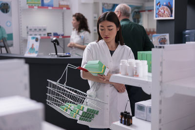 Portrait of young woman working in laboratory