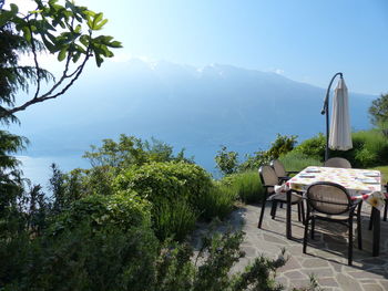 Chairs and table against mountain range