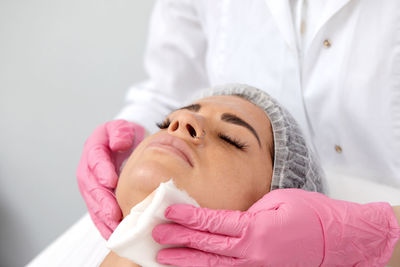 Portrait of doctor examining patient at clinic