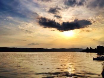 Scenic view of river at sunset