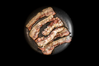 High angle view of meat on barbecue grill