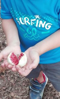 Close-up of boy holding hands