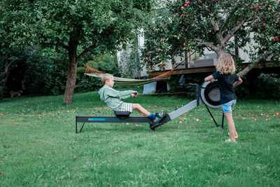 Men sitting on bench in park