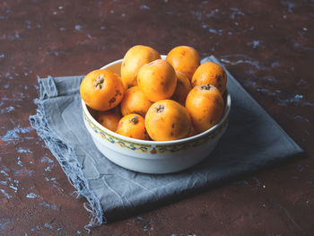 High angle view of fruits in bowl on table