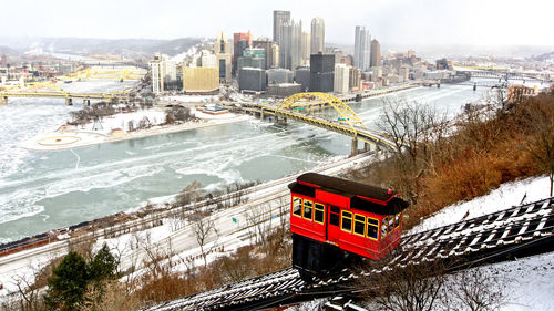 High angle view of city by buildings during winter