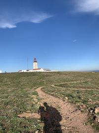 Shadow of a kissing couple nature and lighthouse