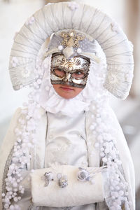 Person looking away while wearing costume and mask