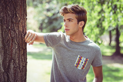 Young man standing at park