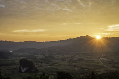 Scenic view of landscape against sky during sunset