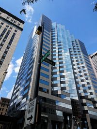 Low angle view of modern buildings against sky